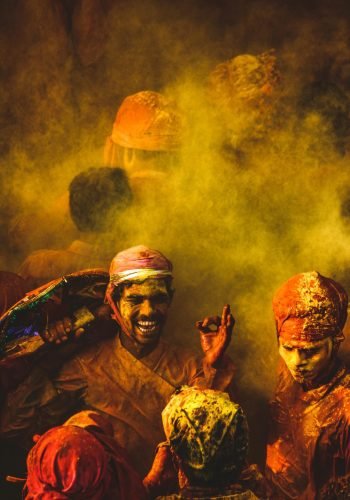 pexels-photo-3367459-3367459 Joyful group celebrating Holi with vibrant colors and traditional attire in India.